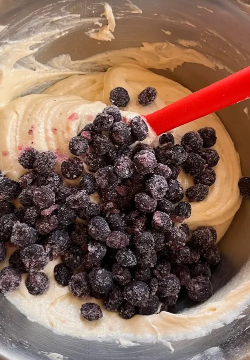 Blueberries folded into cake batter in the studio kitchen