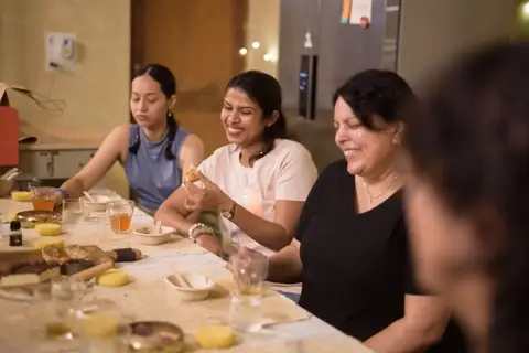 Laughter and tea between the making